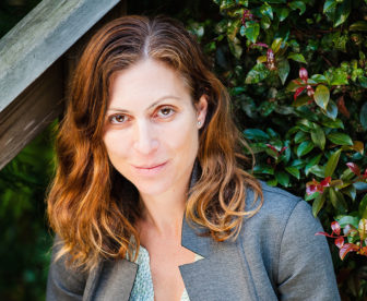 Oakland: Lara Bazelon (headshot), author of book Rectify: The Power of Restorative Justice After Wrongful Conviction, woman with shoulder-length red hair, gray jacket