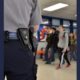 School Safety report; armed security officer in school hallway