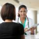 underserved community health grants; female doctor talking to patient