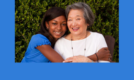 afterschool: Older asian woman mentoring a young African American teenager.