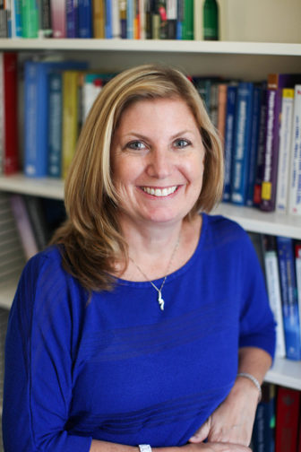 after-school: Sandra Simpkins (headshot), faculty member of University of California, Irvine School of Education, smiling woman with shoulder-length blond hair, blue top, necklace