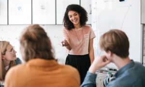 positive youth development grants; young african american woman leading class