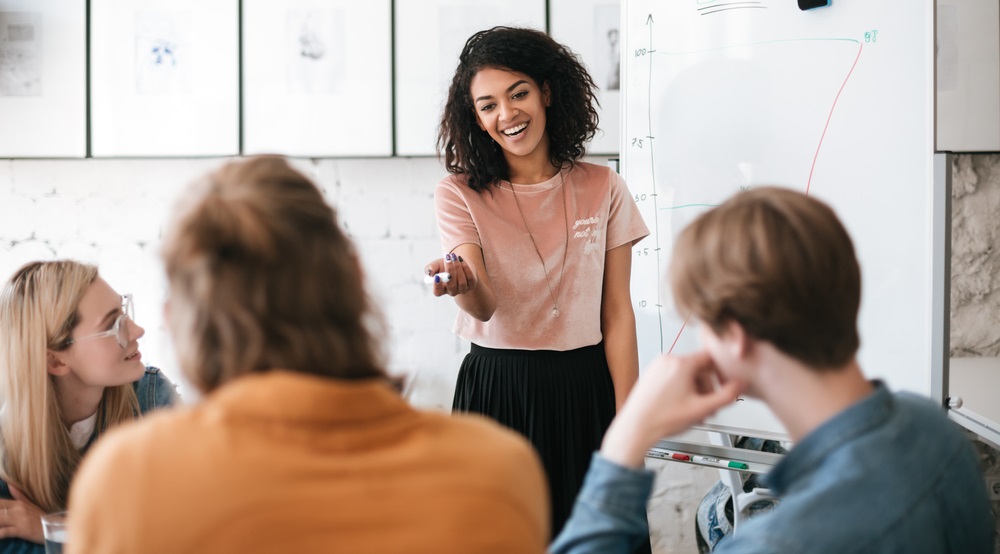 positive youth development grants; young african american woman leading class