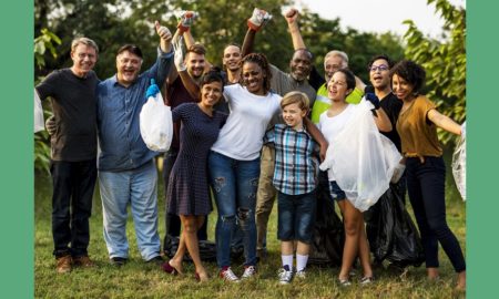 community innovation prize grants; group of diverse people picking up trash