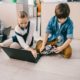 STEM education research grants; children programming robotics on laptop