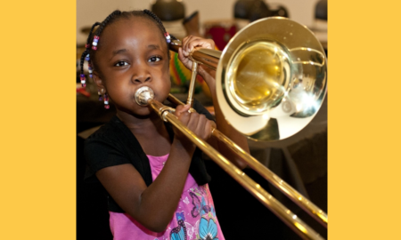 Louisiana afterschool and summer music, arts, culture education grants; young black girl learning trombone