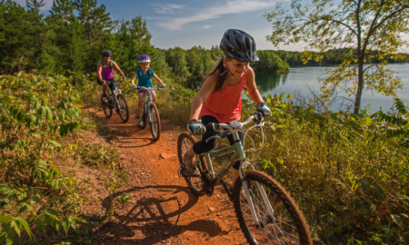 community bike park project grants; happy children riding bikes