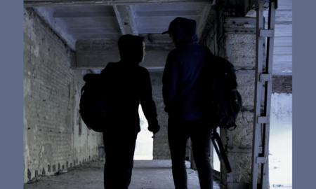 community youth gang suppression grants; hooded youth in abandoned building