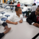 young african american boy learning from mentor