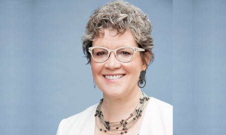 Annie Donovan newsmaker headshot; smiling woman in glasses