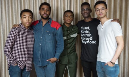 Netflix: 5 young men with arms around each other in front of curtain.