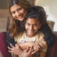 2019 KIDS COUNT Data Book cover; happy ethnic mother and daughter hugging