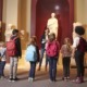 k-12 education overhaul: young students and teacher at history museum