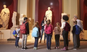 museum improvement, humanities education: young students and teacher at history museum