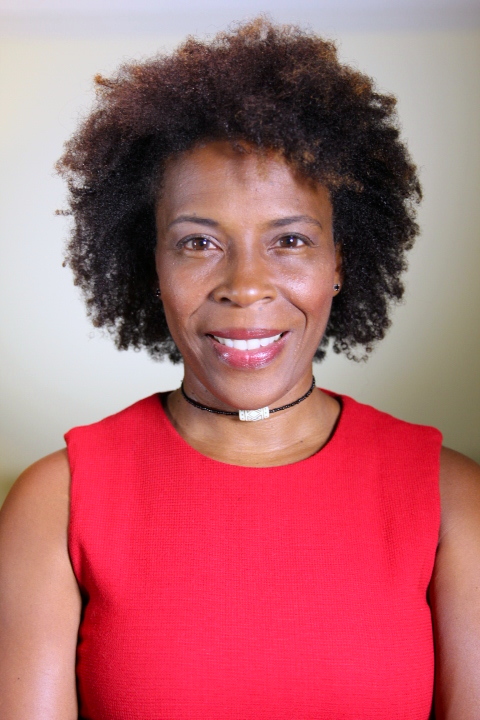cultural sensitivity: Andrea Dennis (headshot), John Byrd Martin Chair of Law at the University of Georgia School of Law, smiling woman with short curly brown hair, necklace, red sleeveless dress.
