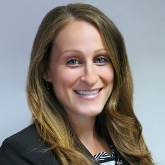 campus support: tag: Sarah Wasch (headshot), program manager at Field Center for Children’s Policy, Practice & Research, smiling woman with long brown hair, black jacket, black and white top