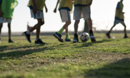 cultural sensitivity: blurred photo of children playing soccer