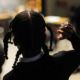 quality education for every child report; young black female student raises hand in class