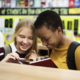 charter school effects on school segregation report; black and white students reading together in school