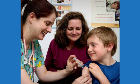 education, environment, health, poverty grants; young child getting a shot from nurse