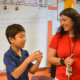New Mexico education and community grants; young student and teacher in classroom
