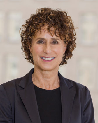 healing: Susan Notkin (headshot), senior vice president at Center for Study of Social Policy, smiling woman with short, curly brown hair, gray jacket, black top 