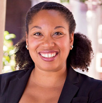 Jaih Craddock (headshot), assistant professor at University of Maryland, smiling woman with brown hair, earrings, black jacket.