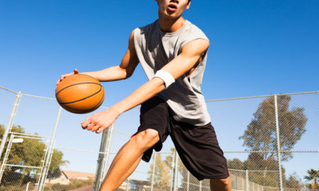 probation: Teen boy playing basketball outdoors
