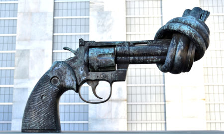 gun violence: Image of pistol with barrel tied in knot