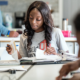 Innovative School Support Grants; black female student working in class