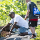 NC Disadvantaged Community Progress Grants; young kid learning community agriculture from mentor