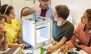 STEM education research improvement grants; students learning about tech from teacher