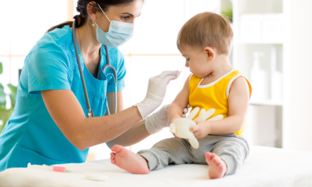 Community-Based Child Healthcare Access grant; doctor helping young child patient