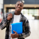 Disadvantaged College Student support services grants; happy black male college student