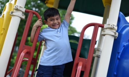 MN early childhood and youth development grants; young ethnic child on playground