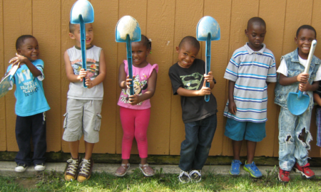 Cincinnati region summer learning program grants; happy children holding shovels at summer program