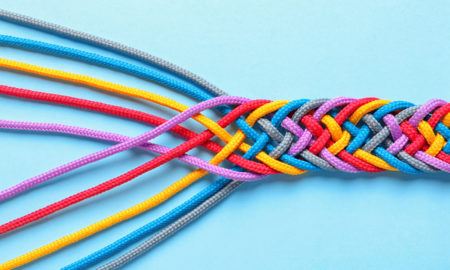 collaboration: Braided ropes on color background, top view.