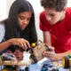 Grades 6-12 STEM Education Project grants; two students working on device