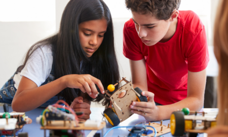 Grades 6-12 STEM Education Project grants; two students working on device