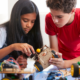 Grades 6-12 STEM Education Project grants; two students working on device