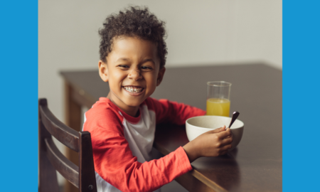 Strategies and Challenges in feeding OST students reports; happy african-american child with bowl of food and drink