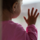 Child Sexual Abuse Prevention Program Support During COVID Grants; young child staring out with hand on window