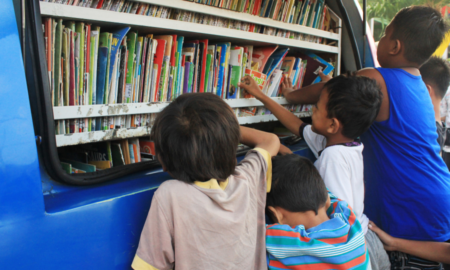 mobile reading programs for youth program support grants; kids getting books from book truck