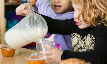 New Jersey Children's Nutritious Food Access Emergency Grants; young child pouring milk into glass