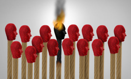 stress: match icon of an employee exhausted with job stress burning out, surrounded by other match icons as a 3D illustration.