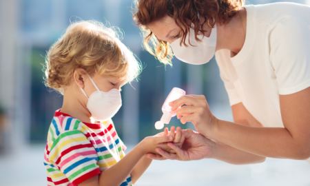 NC Child Care provider support grants; adult and child wear facemasks and use hand sanitizer