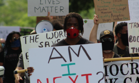 Social Justice Grassroots Organization Support grants; black lives matter protesters march with masks