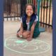 afterschool: Child drawing with chalk