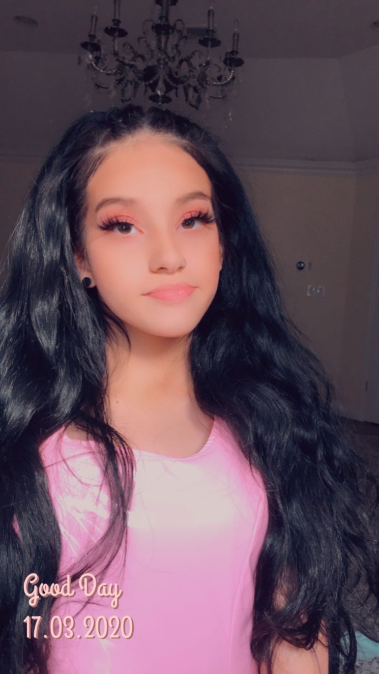 disabilities: woman with long black hair in pink top