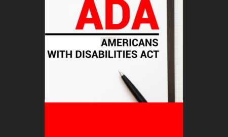ADA: Paper on clipboard with Americans with Disabilities Act ADA on a table